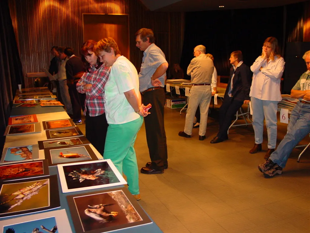 A print evening in the early years – prints laid out on the tables for judging. Photograph from Andre de Kock.